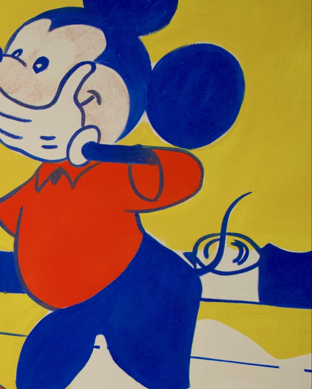 Mickey's face, a gloved hand over his mouth, with red dots on his cheek