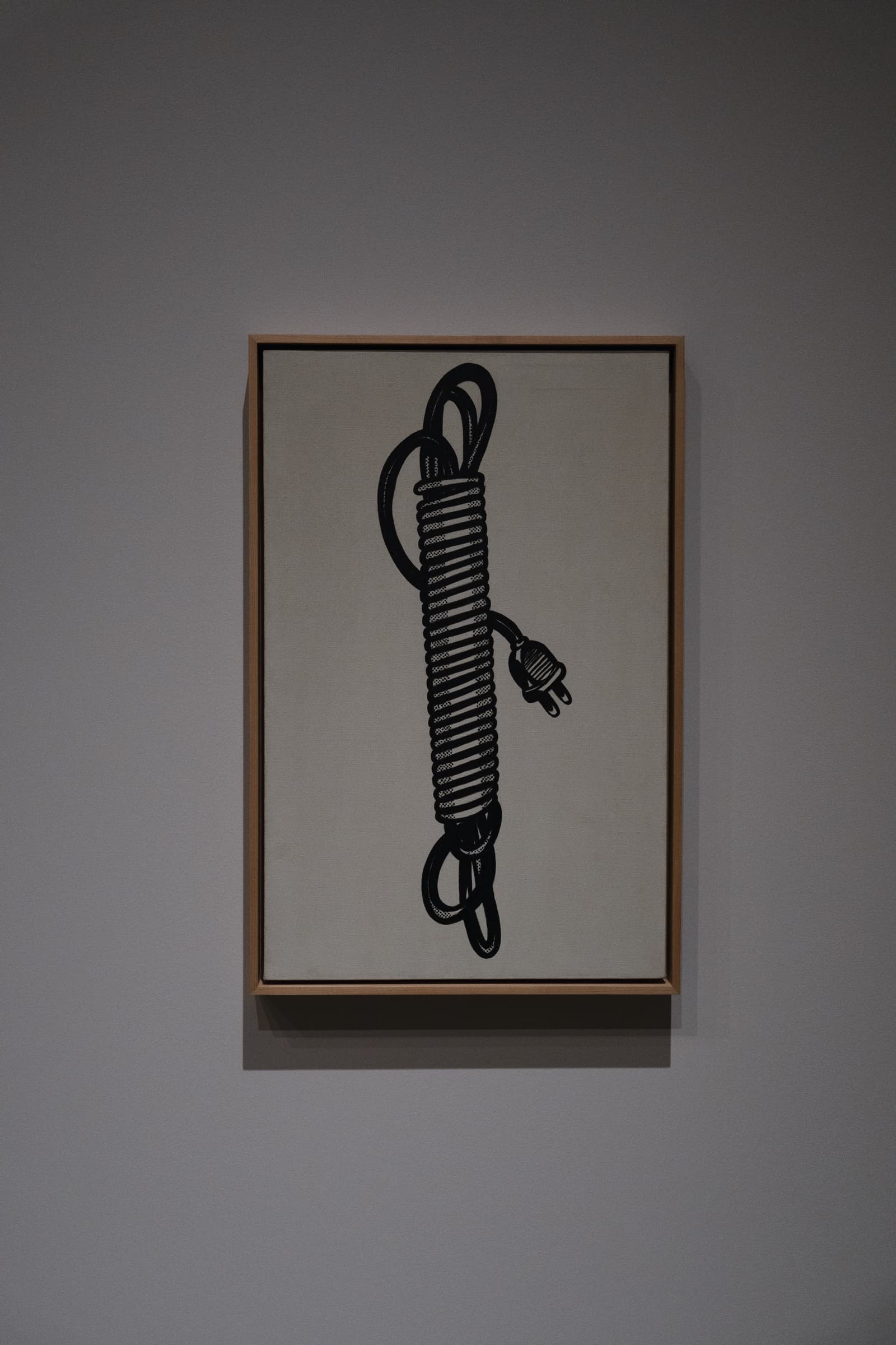 白い画面に黒く描かれた巻いたコード