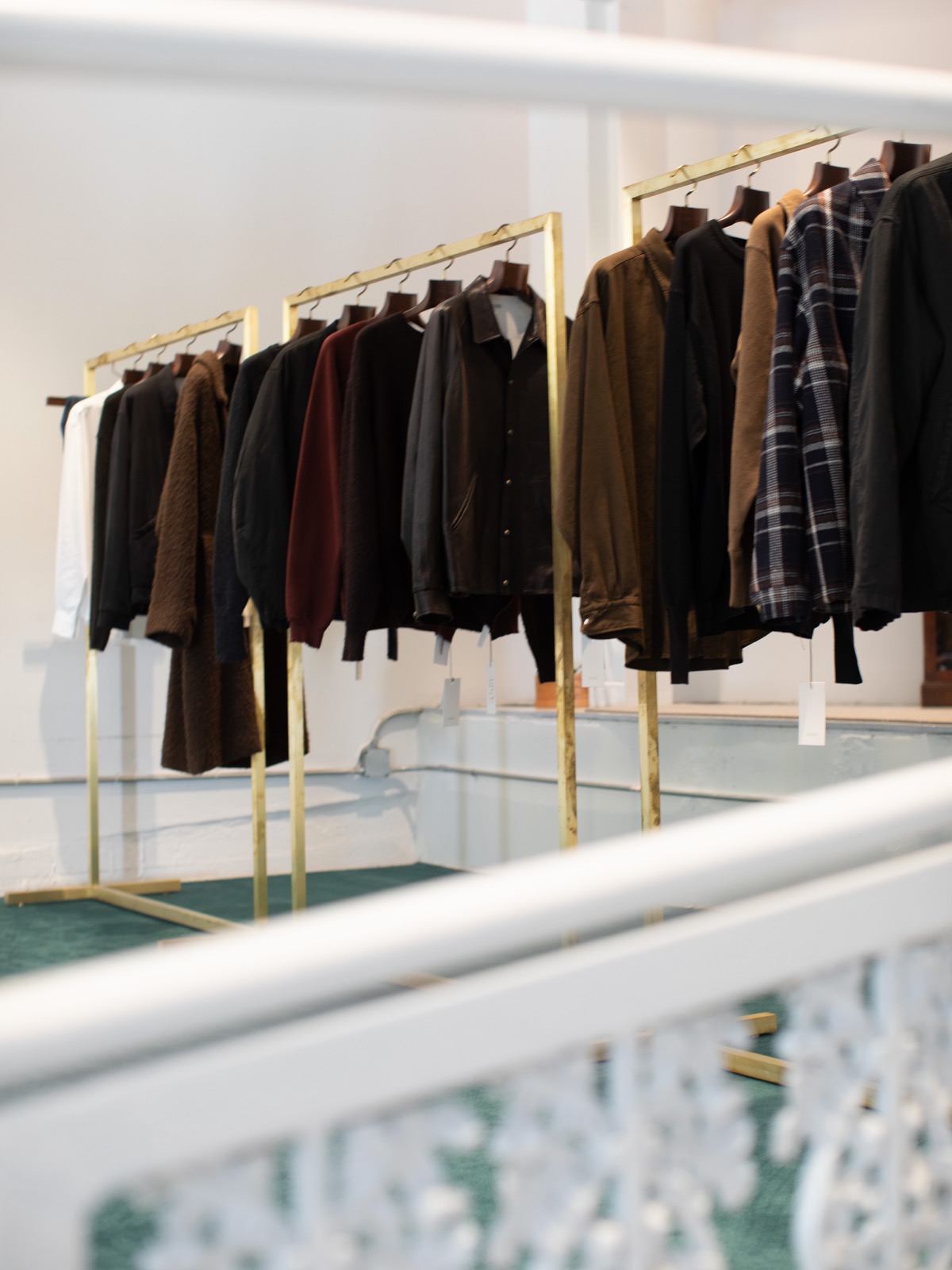 A.PRESSE jackets on brass rails at La Garçonne Men