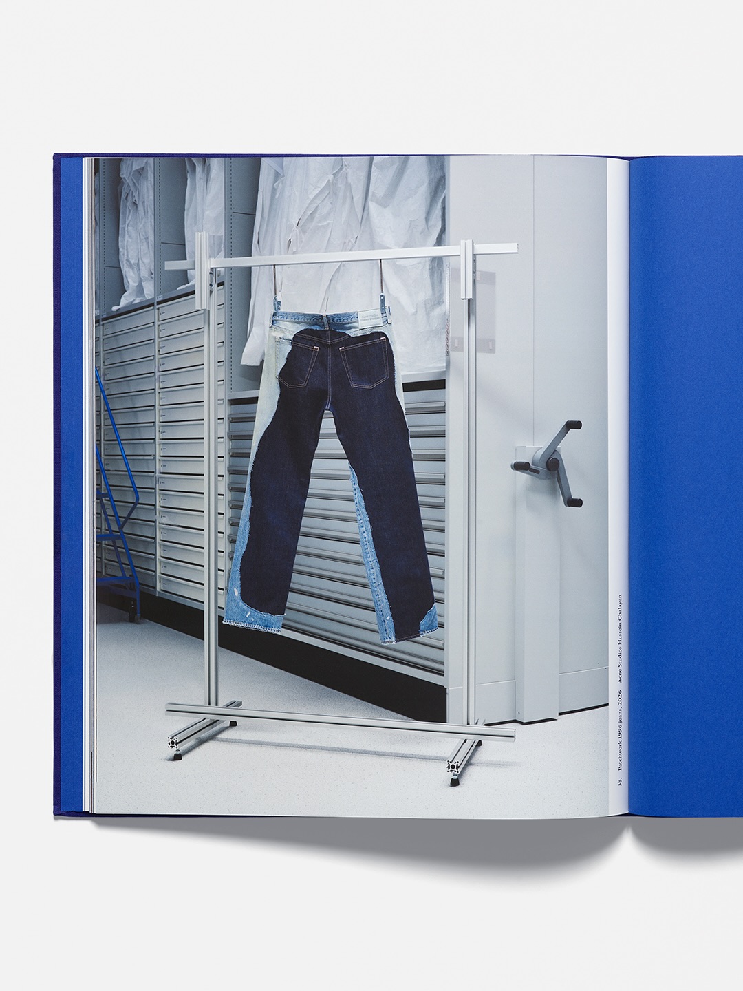 Book spread showing patchwork jeans on a garment rack