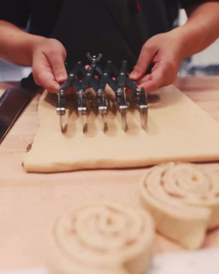 Cutting cinnamon roll dough at Altbau