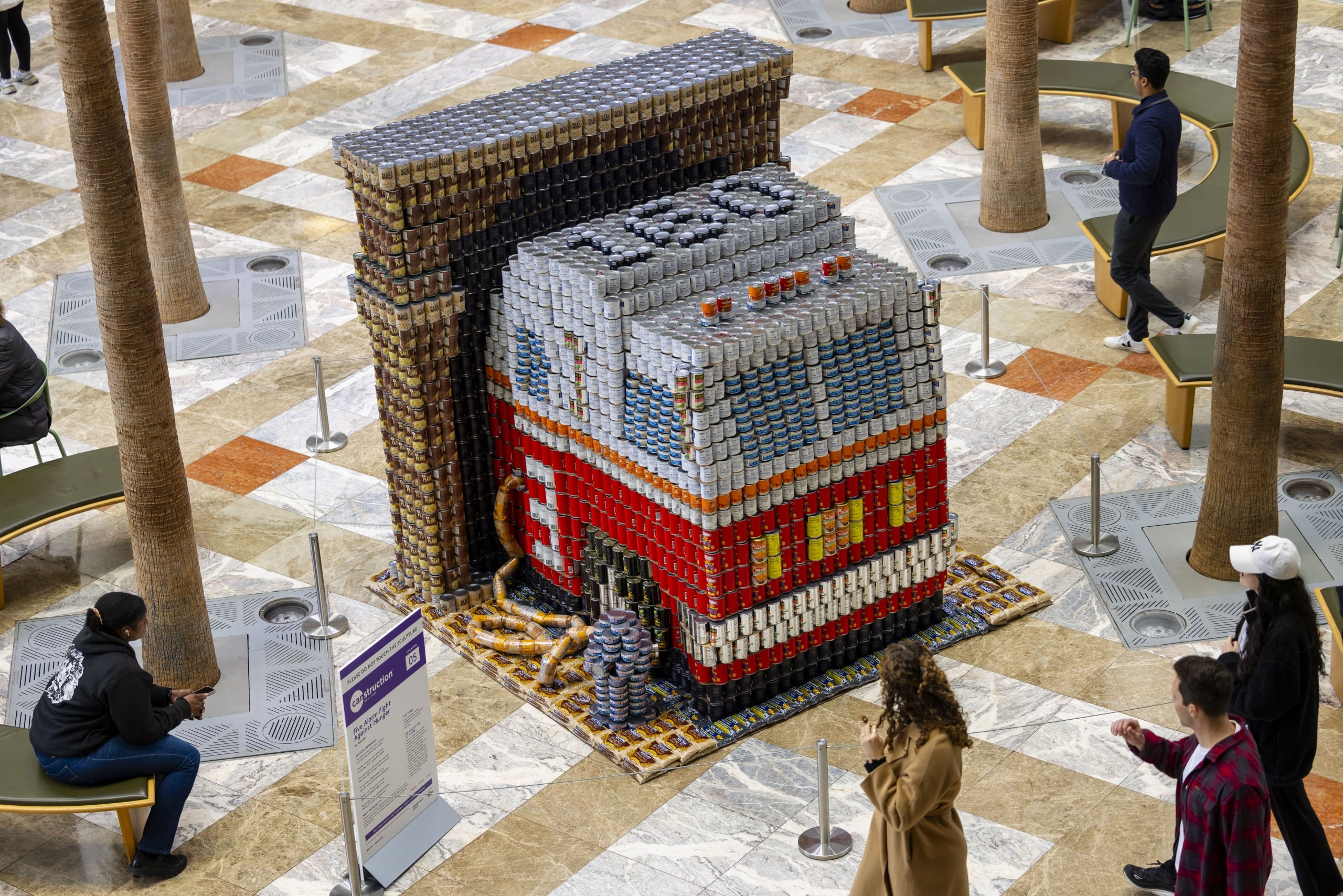 Fire engine sculpture built from cans seen from above in the Winter Garden