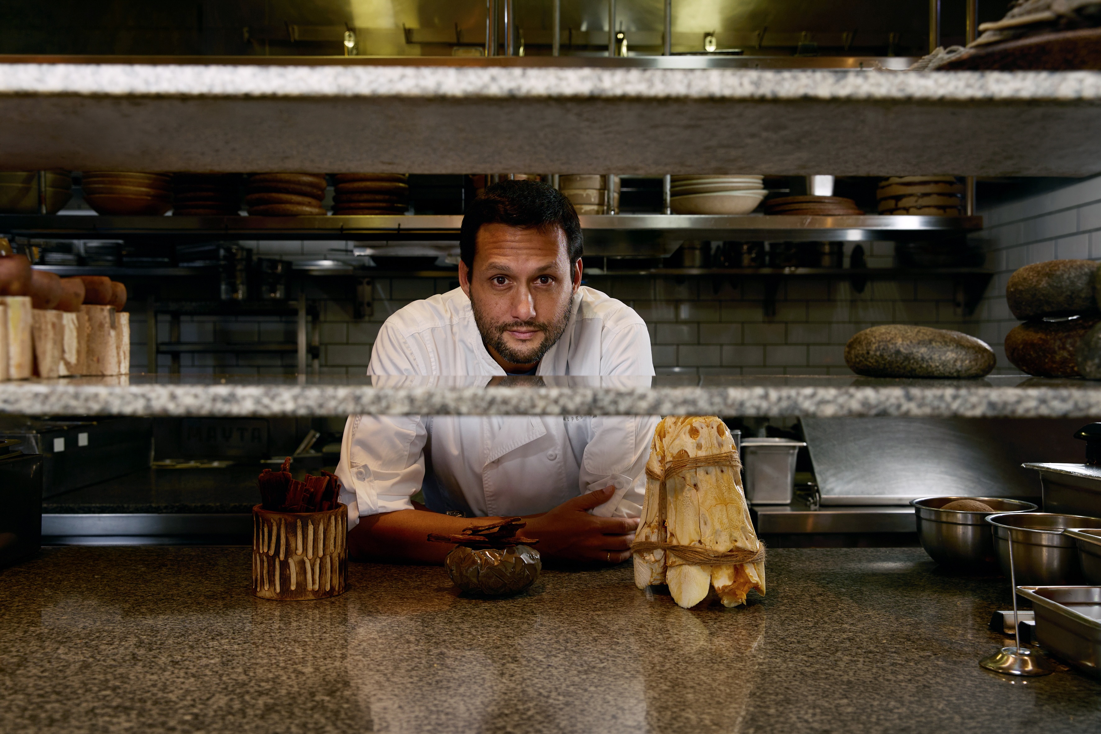 Chef Jaime Pesaque behind the kitchen counter at Mayta