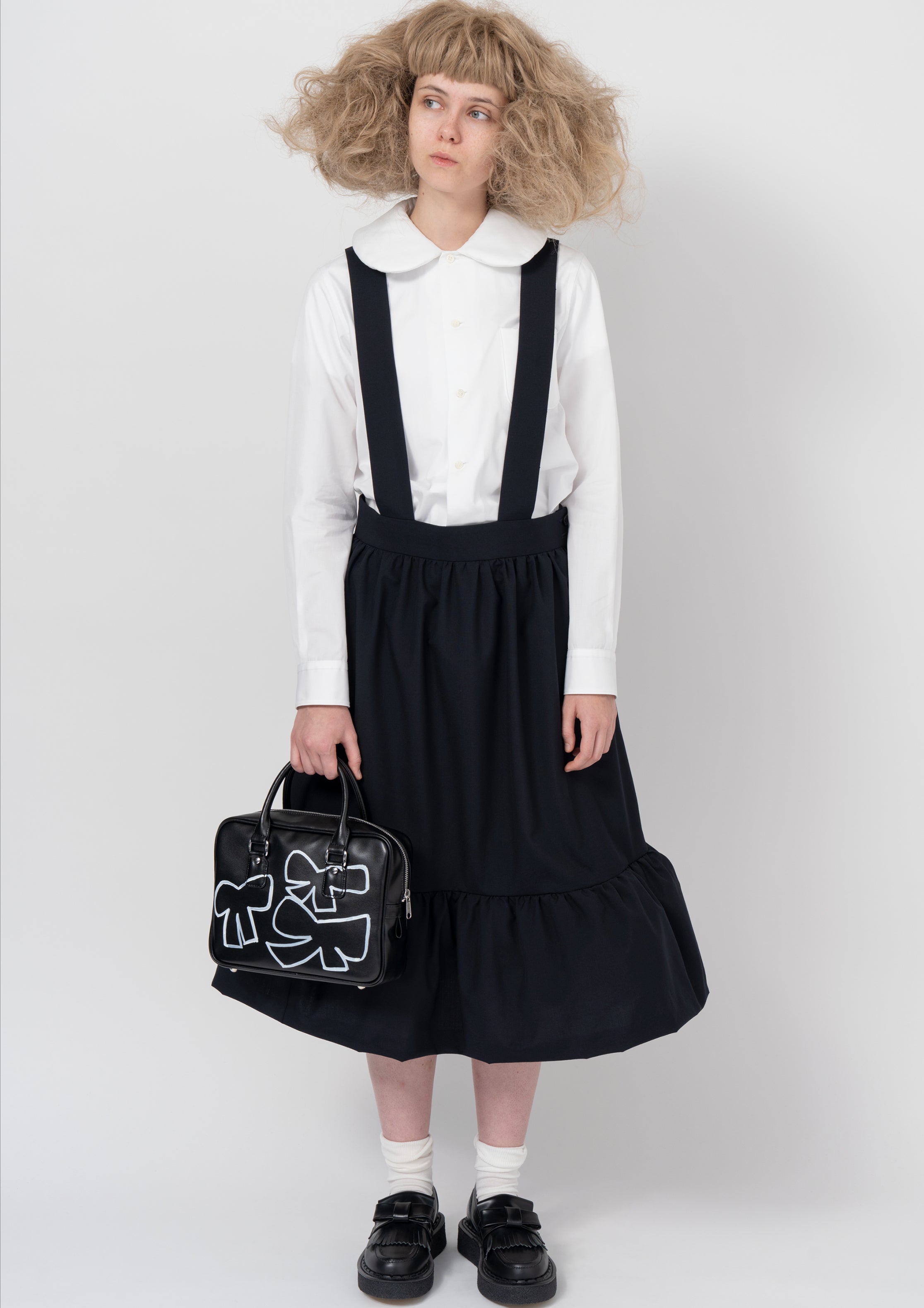 Black blazer with white ruffled collar and tiered skirt from Comme des Garçons Girl FW26