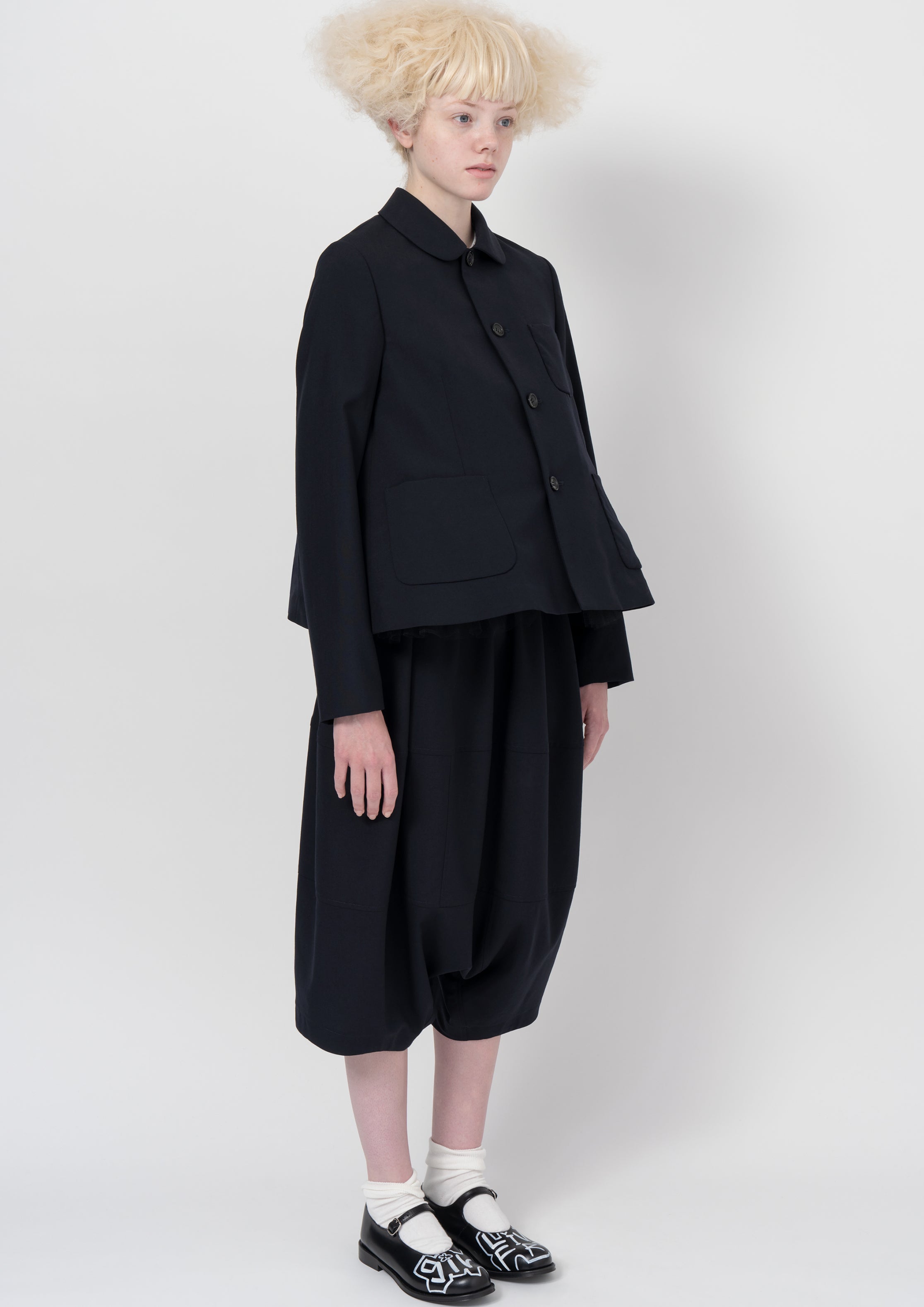 Navy cropped jacket with wide drop-crotch trousers