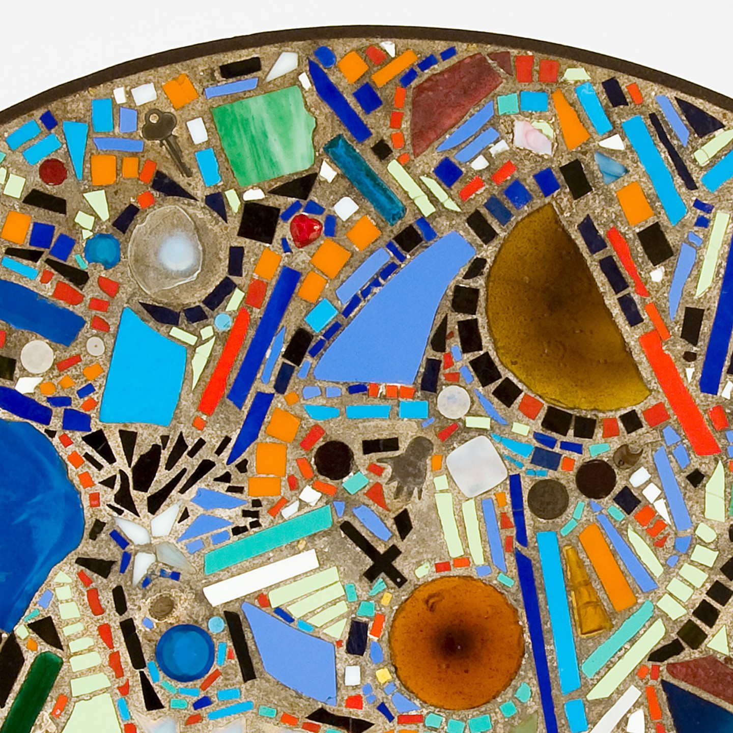 Detail of Mosaic Table with a key, amber glass and small found objects