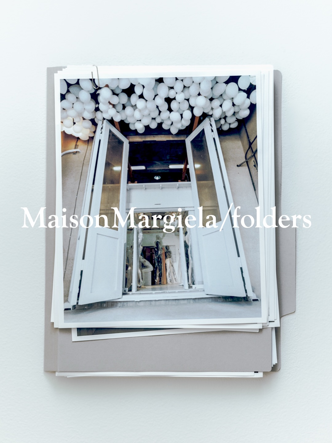 MaisonMargiela/folders print of the Ebisu store entrance under white balloons